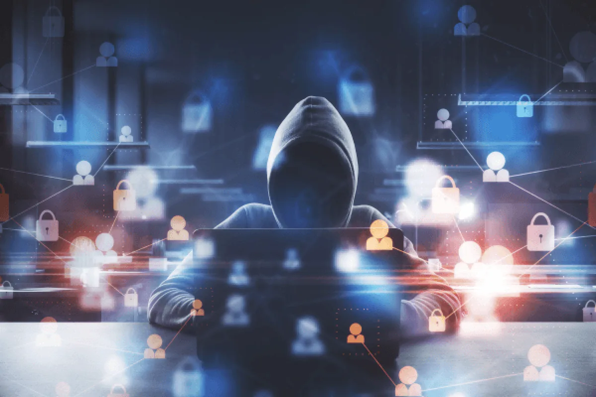 image depicting a hacker using a laptop