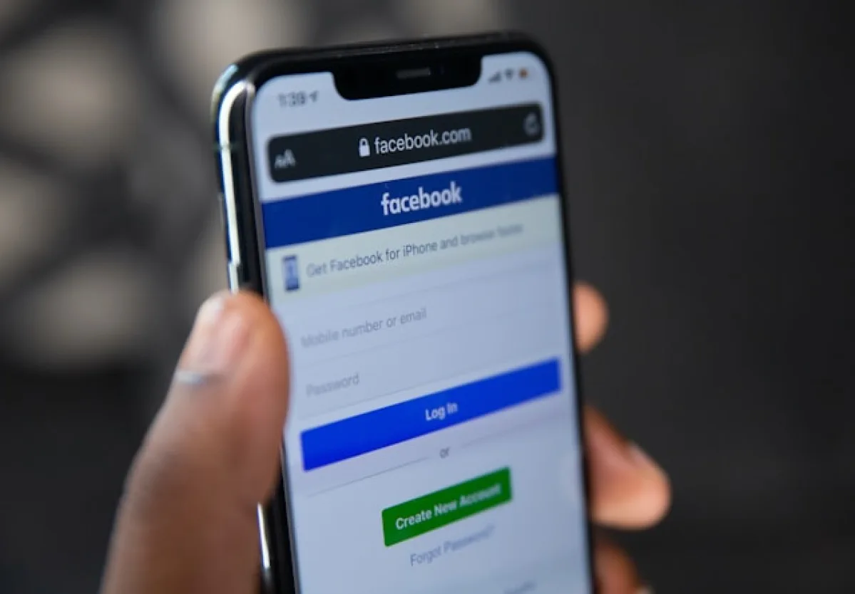 Smartphone displaying the Facebook app as a visual for Facebook phishing scams